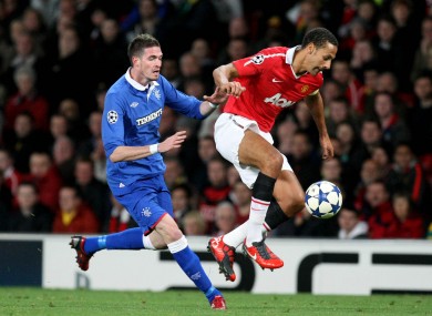 Rio Ferdinand holds off the challenge of Kyle Lafferty.