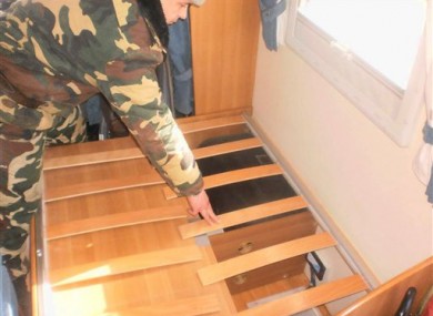 A Border Guard officer examines a place in a trailer where two hidden babies were found at checkpoint Luzhanka, Ukraine.