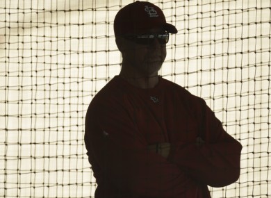 St Louis Cardinal's hitting coach Mark McGwire watches batting practice..