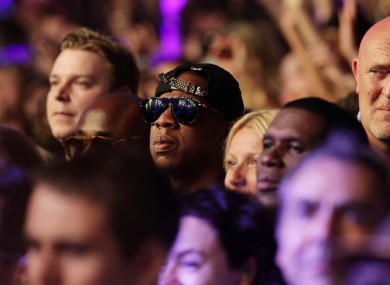 Jay-Za watches Beyonce at Glasto last night. The couple will be on centre court today.