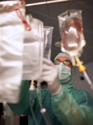 Doctor Hauke Weilert prepares a kidney dialysis for an E. coli patient at Asklepios Hospital in Hamburg-Altona, Germany.