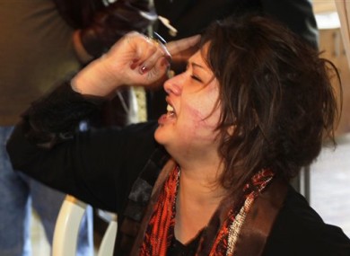Iman al-Obeidi is seen after bursting into a hotel to show her wounds and allege to foreign journalists that she was gang raped by Muammar Gaddafi's troops.