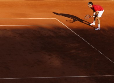 Roger Federer waits for Gael Monfils to serve yesterday.
