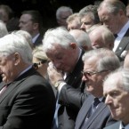 Former TD Noel Treacy (centre) joins other mourners outside St Mochta's Church in Porterstown. (Niall Carson/PA Wire)