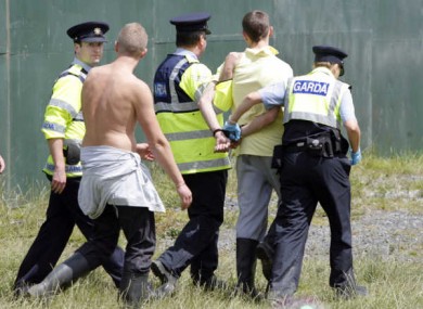 A festival goer is taken away by Gardaí at Oxegen 2011