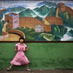 A girl eats snacks during a class break at a school for migrant workers' children in a Beijing suburb, China, Thursday, Aug. 25, 2011. 


(AP Photo/Alexander F. Yuan)