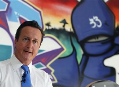 David Cameron speaks at a youth center in Witney, his Parliamentary district in southern England, Monday, Aug 15, 2011.