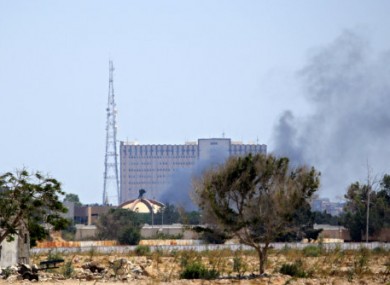 Smoke billows over Muammar Gaddafi's compound.