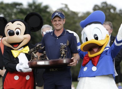 Luke Donald with Mickey Mouse, left, and Donald Duck.