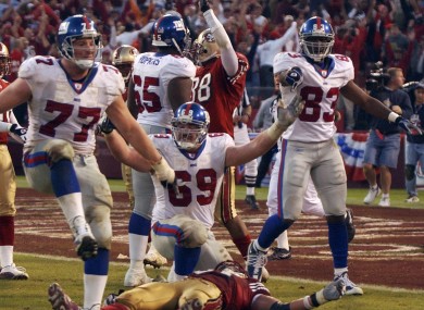 New York Giants' Rich Seubert (69), Luke Petitgout (77), Tam Hopkins (65) and Marcellus Rivers (83) look for a pass interference call after a botched field goal attempt against the San Francisco 49ers in the closing moments of an NFL football playoff game in San Francisco in 2003.