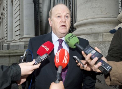 Michael Noonan speaks to the media as he arrives at Government Buildings today for the first Cabinet meeting of the new year