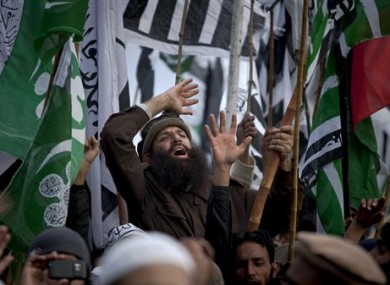 A supporter of a Pakistani religious party shouts religious slogans during a rally in Rawalpindi on Sunday, Jan. 22, 2012, when many Islamists rallied against the US and India.