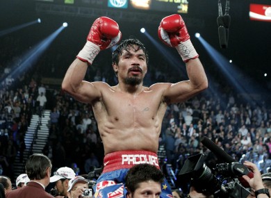 Pacman celebrates his controversial win over Juan Manuel Marquez in November