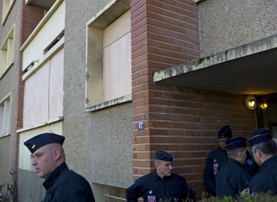 French police officers outside Mohamed Merah's apartment building in Toulouse on Friday