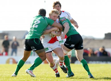 Nevin Spence is tackled by Henry Fa'afili and Kyle Tonetti
