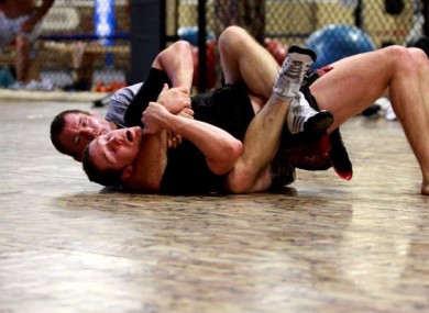 Damien 'The Rage' Rooney and Matt Hughes in action
