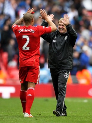 Glen Johnson and Dalglish celebrate victory over Everton.