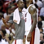 Miami Heat forward LeBron James and guard Dwyane Wade talk during the first round of the Eastern Conference playoffs against the New York Knicks. James had 29 points and Wade had 19 as the Heat won 106-94 to win the series 4-1 and advance to the second round.