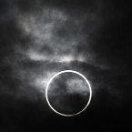 An annular solar eclipse is visible from Machida, on the outskirts of Tokyo. The annular solar eclipse, in which the moon passes in front of the sun leaving only a golden ring around its edges, was visible to wide areas across the continent Monday morning. (AP Photo/Itsuo Inouye)