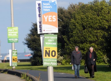 There's just no escaping the posters: walkers in north Dublin yesterday
