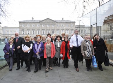 Sinn Féin spokesperson Caoimghghin O'Caolain and party leader Gerry Adams pictured with survivors of symphysiotomy in March 2012