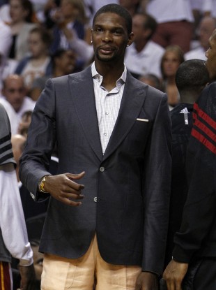 Miami Heat's Chris Bosh watches from the bench.