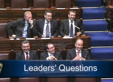Six Fianna Fáil TDs laughing during Leaders' Questions
