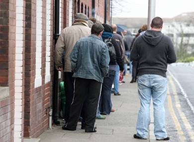 People queue at a social welfare office in Dun Laoghaire