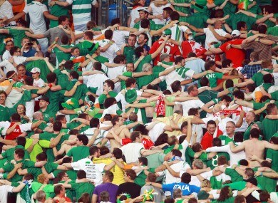 Republic of Ireland supporters do 'The Poznan' during the Italy game.