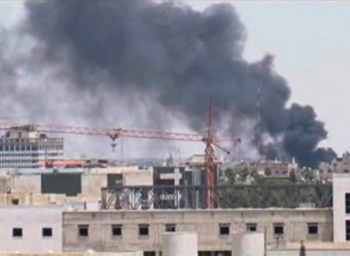 In this image taken from AP video, thick black smoke rises over the Damascus skyline after a powerful explosion rocked the Syrian capital yesterday.