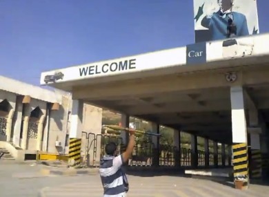 A Syrian rebel raising a rocket-propelled grenade at the Bab al-Hawa border crossing with Turkey