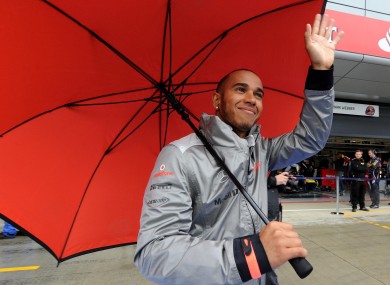 Vodafone McLaren Mercedes driver Lewis Hamilton walks down the pit lane.