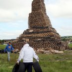 Men carry tyres to the bonfire at New Mossley (Paul Faith/PA Wire)
