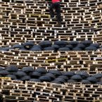 A man climbs the New Mossley bonfire (Paul Faith/PA Wire)