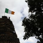 Children stand on the bonfire in the Shankill Estate (AP Photo/Peter Morrison)
