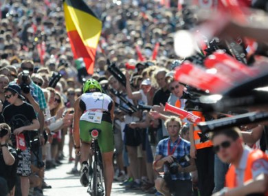 Competitors battle through the crowds during the 180km bike leg in Roth.