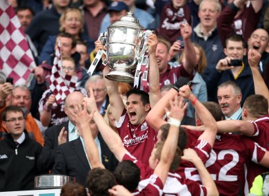 Sixteen years after marking Ciaran Murphy in a Connacht colleges game, Fergal Moore lifted the Bob O'Keeffe trophy yesterday.
