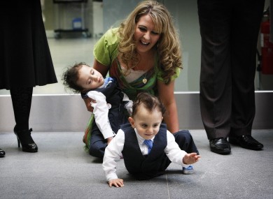 Angie Benhaffaf enjoys her playful twin sons Hassan and Hussein as they wait to meet Queen Elizabeth II on her visit to Cork last year.