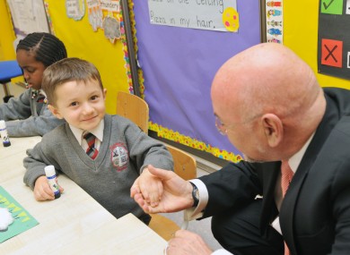 You did good, kid. Ruairí Quinn meets junior infant Joshua Ghuzian at a school in Ongar last year.