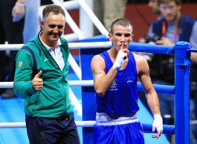 reland's John Joe Nevin celebrates with coach Billy Walsh.