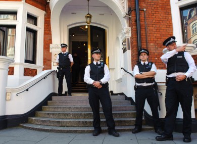 Police officers outside the Ecuadorian Embassy in Knightsbridge, London, where Wikileaks founder Julian Assange is claiming asylum in an effort to avoid extradition to Sweden.