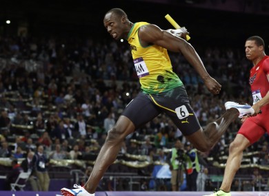 Jamaica's Usain Bolt, left, crosses the finish line ahead of Ryan Bailey of the United States in the men's 4x100-meter relay final.