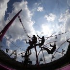 In this multiple exposure photo, Canada's Damian Warner competes in the men's decathlon pole vault during the athletics in the Olympic Stadium at the 2012 Summer Olympics, London, Thursday, Aug. 9, 2012. (AP Photo/David J. Phillip )