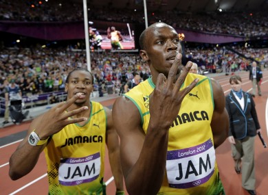 Blake and Bolt celebrate after setting a relay world record.