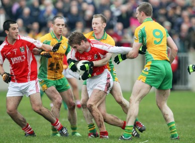 Corofin's Michael Comer tackles Tuam Stars Gary O'Donnell in last year's Galway senior football final.