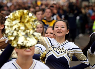 Cheerleaders parade down Kildare Street for a pep rally in Trinity College ahead of this weekend's Global Ireland Football Tournament.