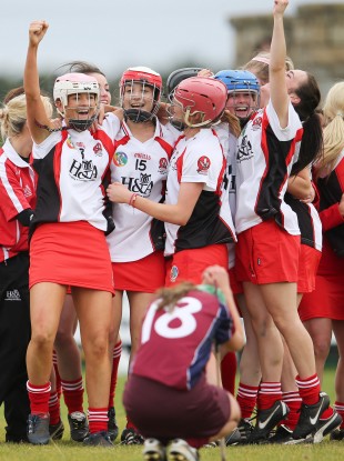 Derry players celebrate their win.