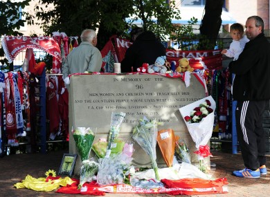 Liverpudlian David Roberts (centre, back to camera) outside Hillsborough, while his father, also named David (right), holds Kyle Roberts. The two Hillsborough survivors returned to the ground for the first time in 23 years today.