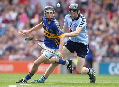 Tipperary's Mark McCarthy is chased by Dublin's Shane Barrett during the drawn game.