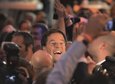 Dutch prime minister Mark Rutte greets supporters last night